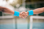 Two tennis players giving a handshake. African american professional tennis players greeting before a match. Tennis players collaborate before a practice match on the court