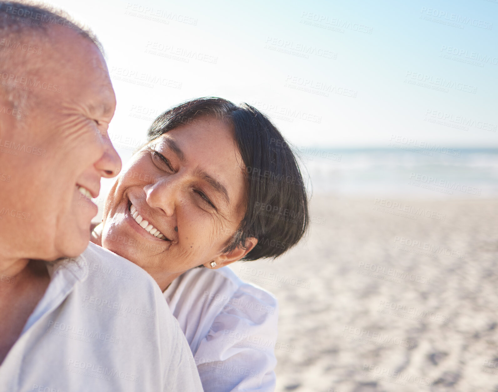 Buy stock photo Happy, mature couple and hug on beach with love, bonding and romance date on retirement travel for marriage. Smile, woman and man with embrace of relationship, commitment and loyalty on ocean outdoor