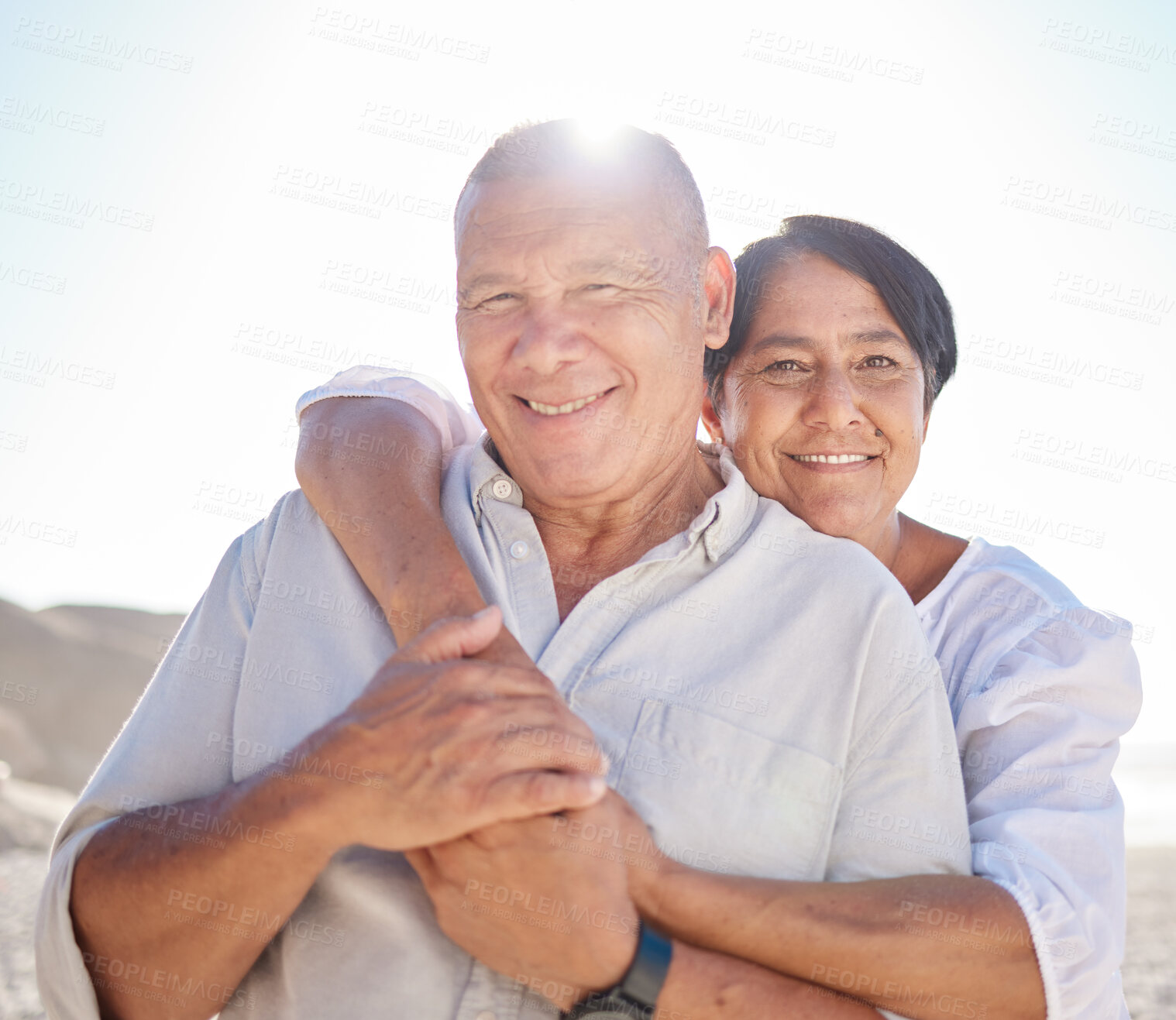 Buy stock photo Portrait, mature couple and hug on beach with love, bonding and romance date on retirement travel for marriage. Smile, woman and man with embrace of relationship, commitment care and loyalty outdoor