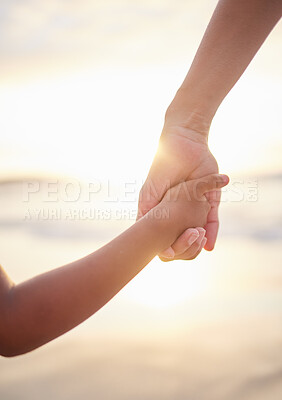 Buy stock photo Sunset, parent and kid with holding hands on beach, security and bonding together with safety. Holiday, vacation and support in California for person, child or connection as family on adventure break