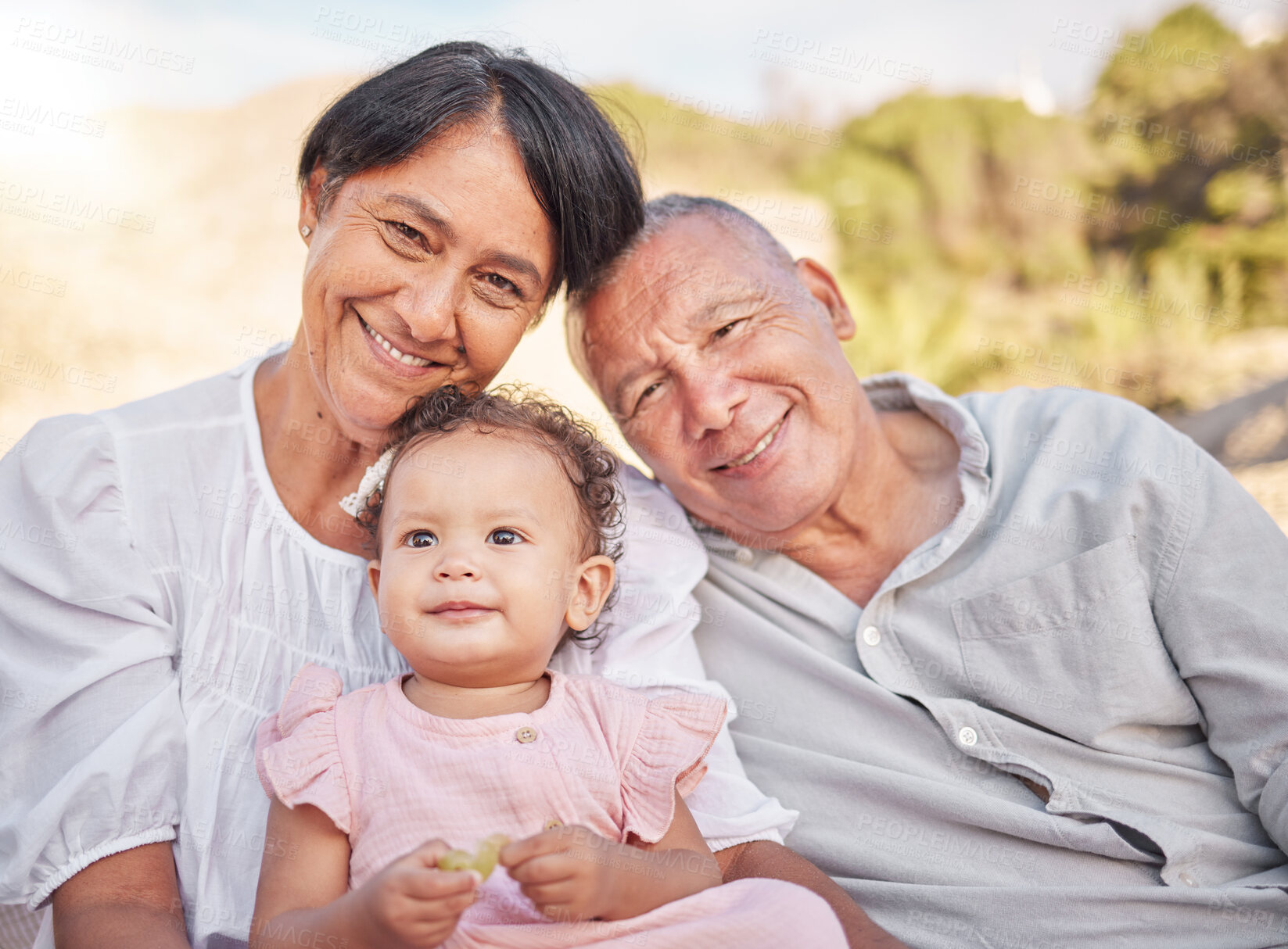 Buy stock photo Grandparents, portrait and baby outdoor with smile, travel and summer vacation in park. Holiday, family and youth together with care, bonding and love with happy senior people and child in nature