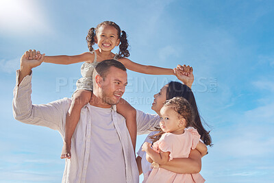 Buy stock photo Family, portrait and carrying on outdoor vacation, love and bonding support in relationship. Parents, children and relax on holiday in nature together, weekend trip and playful daughter by blue sky