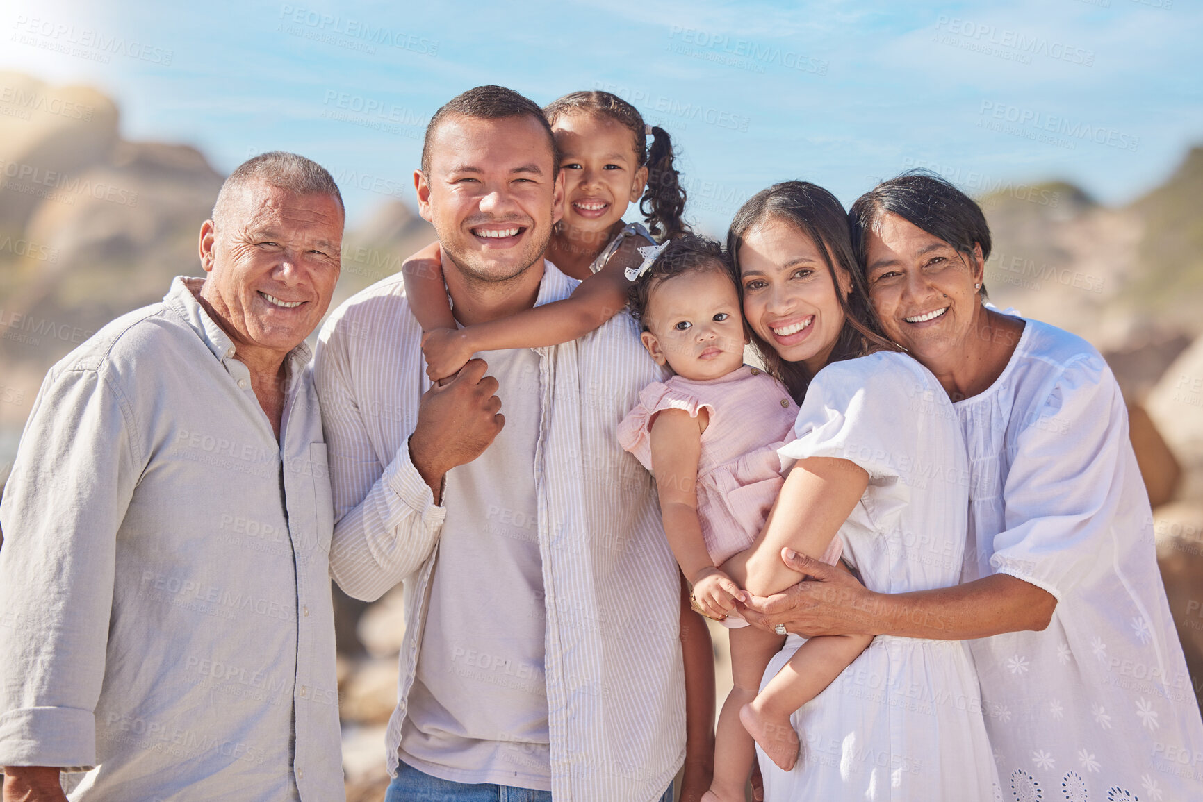 Buy stock photo Portrait, big family and outdoor in beach, fun and grandparents in vacation with group or bonding. Sea, woman and man with kids for holiday with senior people, summer and break for children in Canada