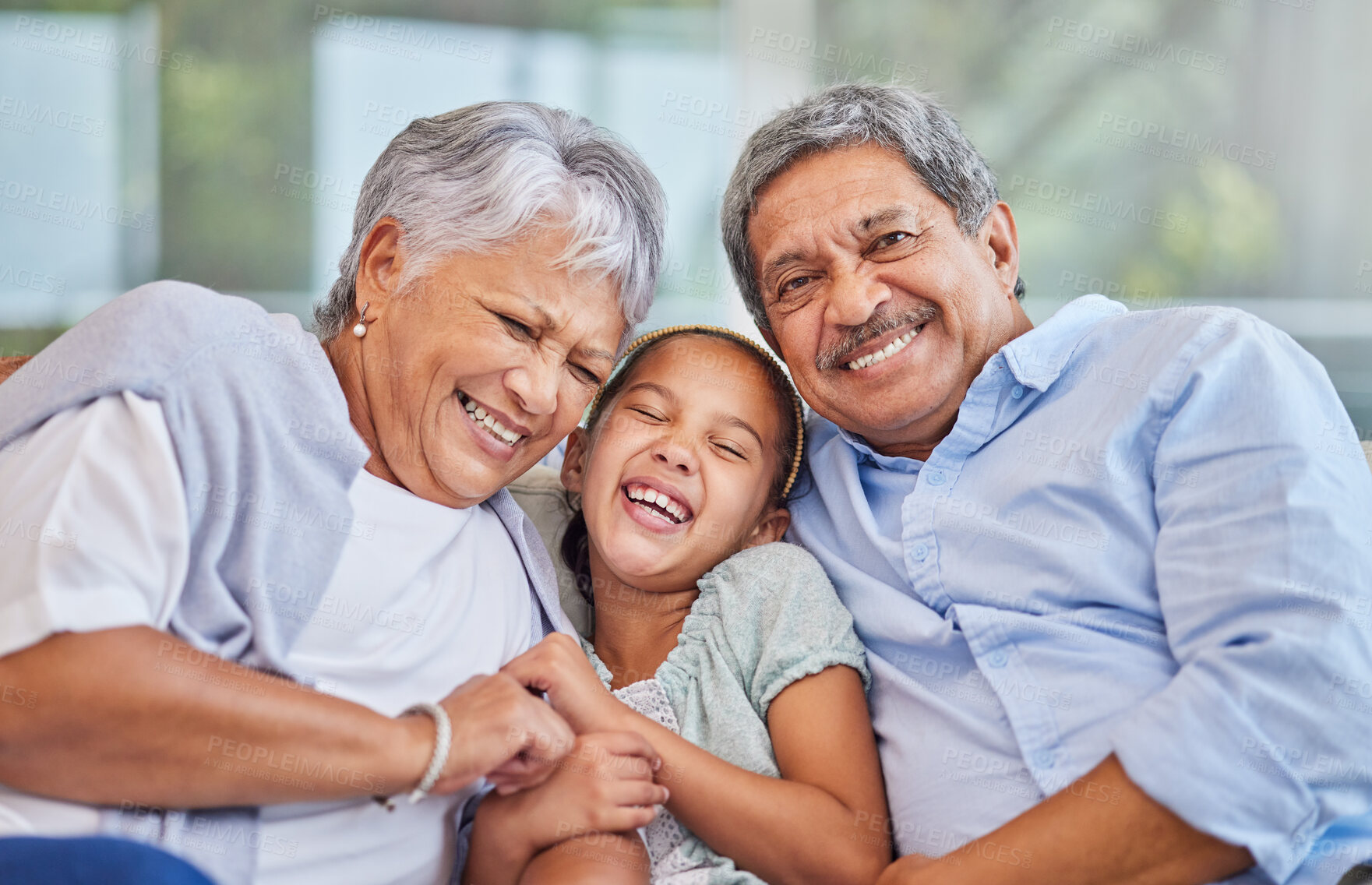 Buy stock photo Grandparents, girl and laugh at home on portrait in sofa for love, support and bonding as pensioners. People, family and happy for visit on couch in living room with kid for fun, care and break