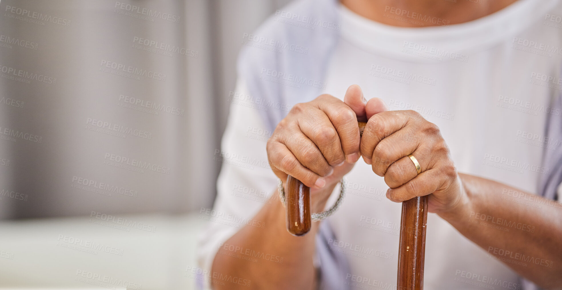 Buy stock photo Senior person, hands and walking stick in home for mobility support, balance and movement in retirement. Homecare, wellness and cane for rehabilitation, recovery and injury assistance in living room