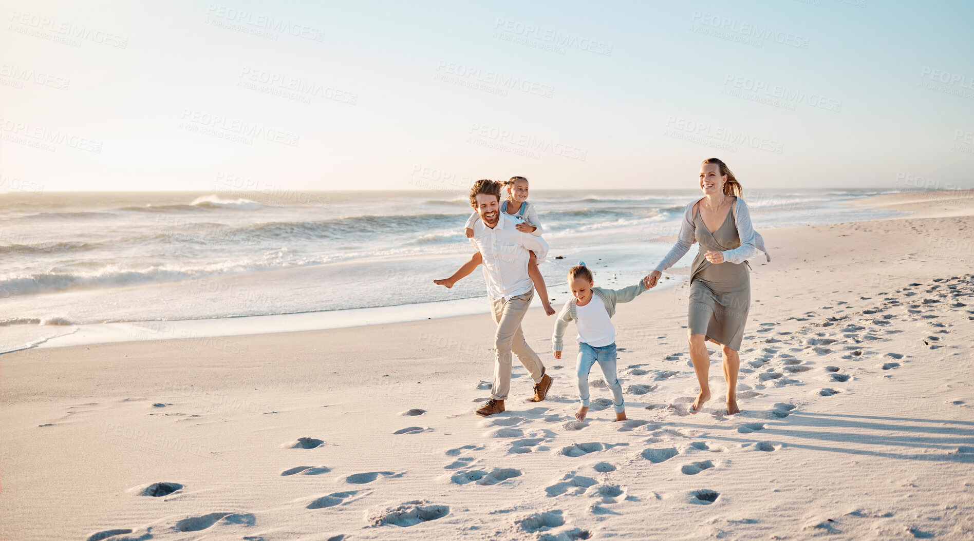 Buy stock photo Beach, sunset and family with children on sand for outdoor adventure, holiday and weekend trip. Happy, mother and father with kids by ocean in summer for travel, journey and vacation in Florida