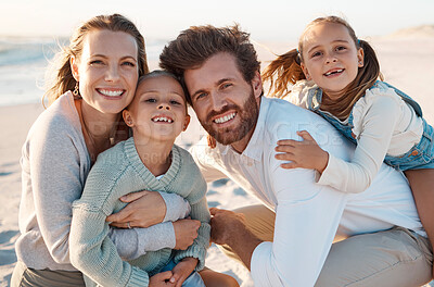 Buy stock photo Parents, children and hug at beach, portrait and smile with care, love or bonding on holiday in summer. Father, mother and daughter kids for embrace, happy or connection in sunshine by ocean in Spain