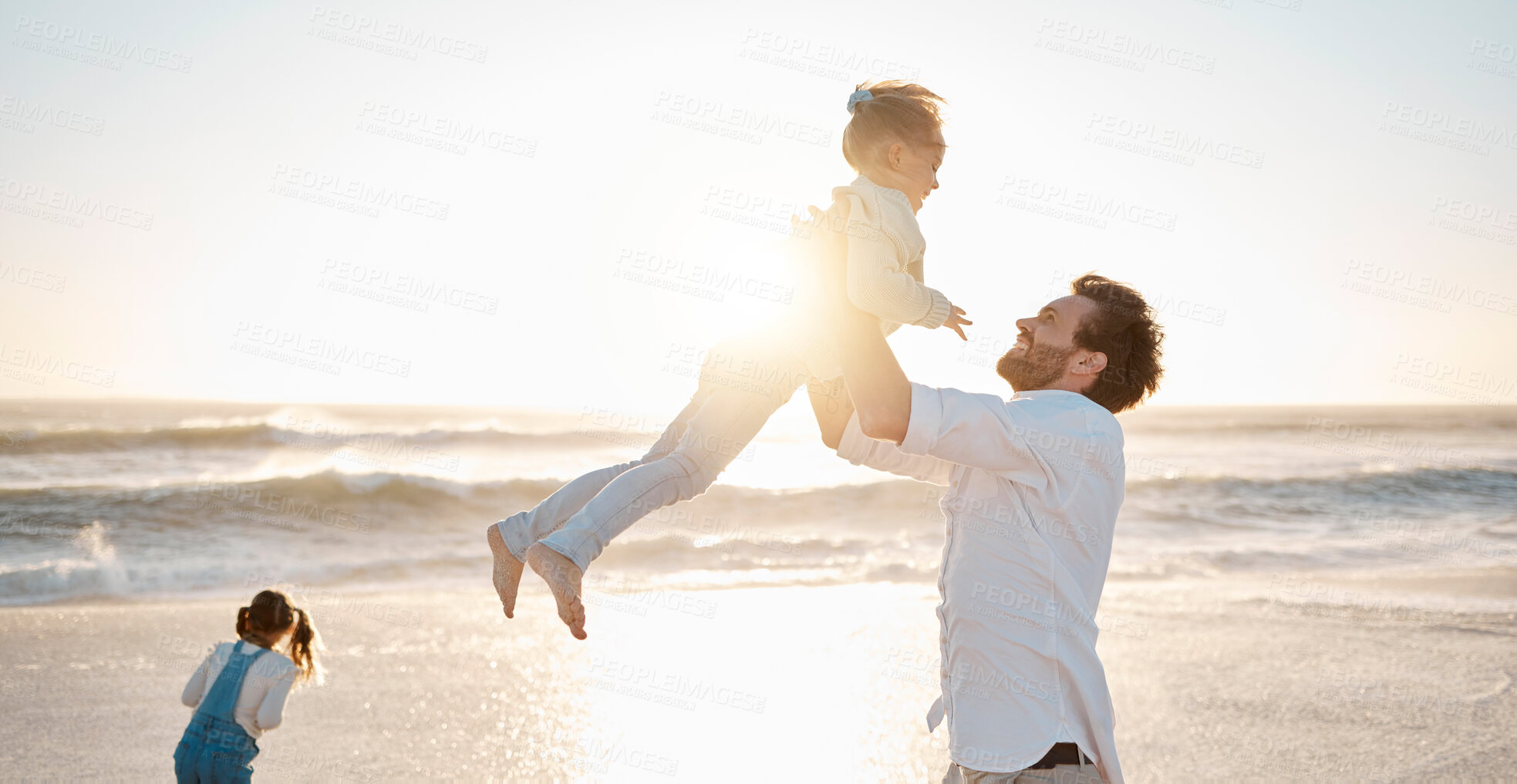 Buy stock photo Father, girl and lifting at beach for travel, bonding and sunset while on vacation together with smile. Dad, children and carrying outdoor by sea for dusk, relationship or family adventure on holiday