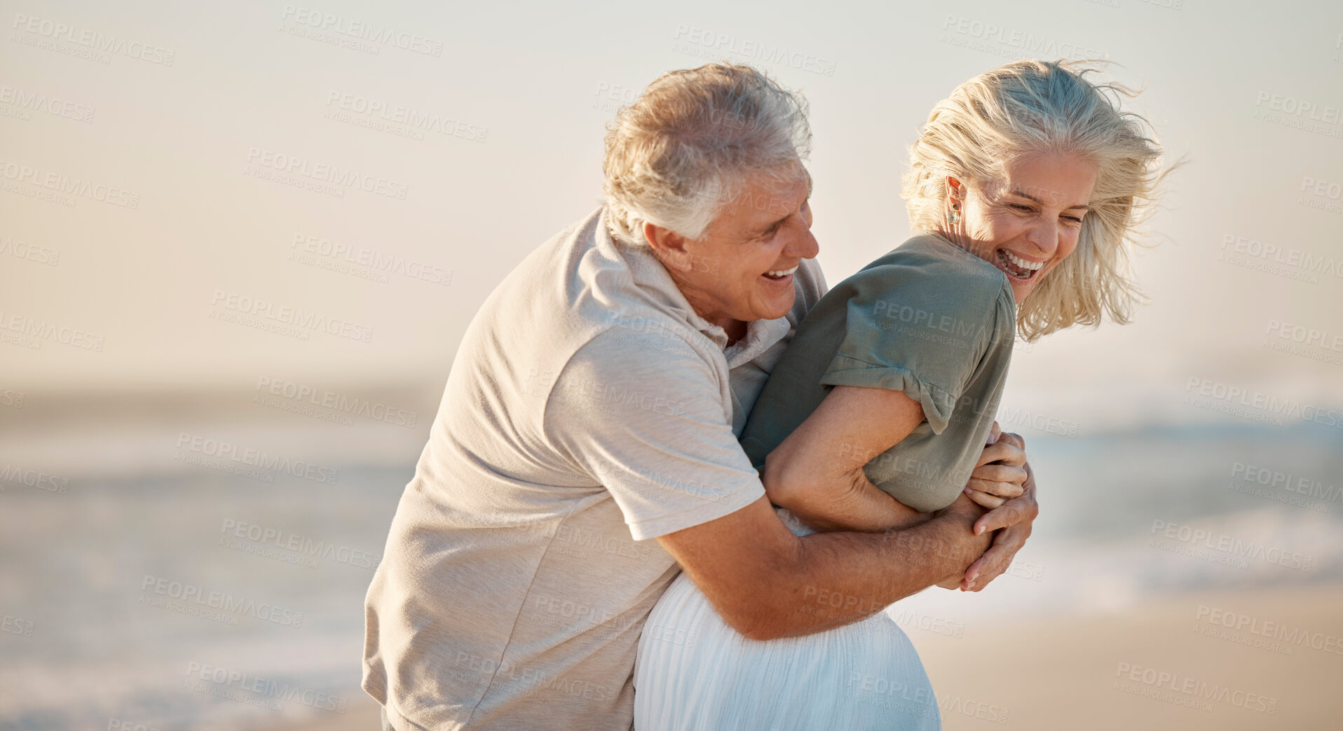 Buy stock photo Laughing, beach and senior couple fun with love, play and silly on anniversary holiday or date outdoor. Sea, comedy and commitment of people with smile and embrace on summer vacation in Greece