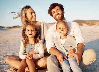 Buy stock photo Parents, children and portrait at beach, vacation and smile with care, love or bonding on sand in summer. Father, mother and daughter kids with embrace, family and sunshine on holiday in Spain