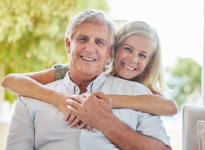 Buy stock photo Senior couple, portrait and hug on sofa in home, happy and care with connection, relax and love in retirement. Elderly man, woman and smile in embrace, bonding and together at apartment in Germany