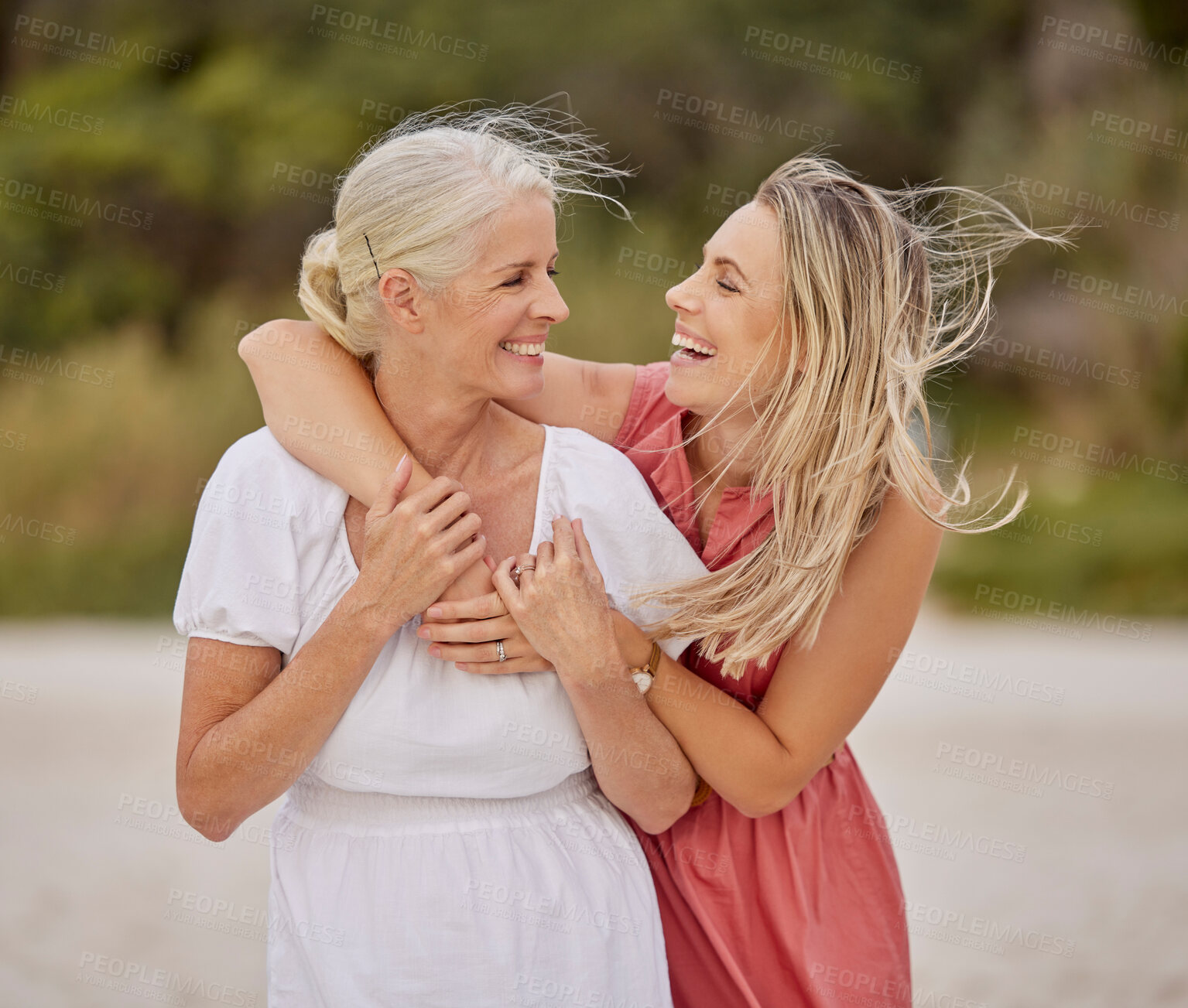 Buy stock photo Laugh, beach and senior mom with daughter for happy bonding holiday, love and embrace on weekend travel. Nature, mother and mature woman on ocean adventure together with hug, fun and island vacation.