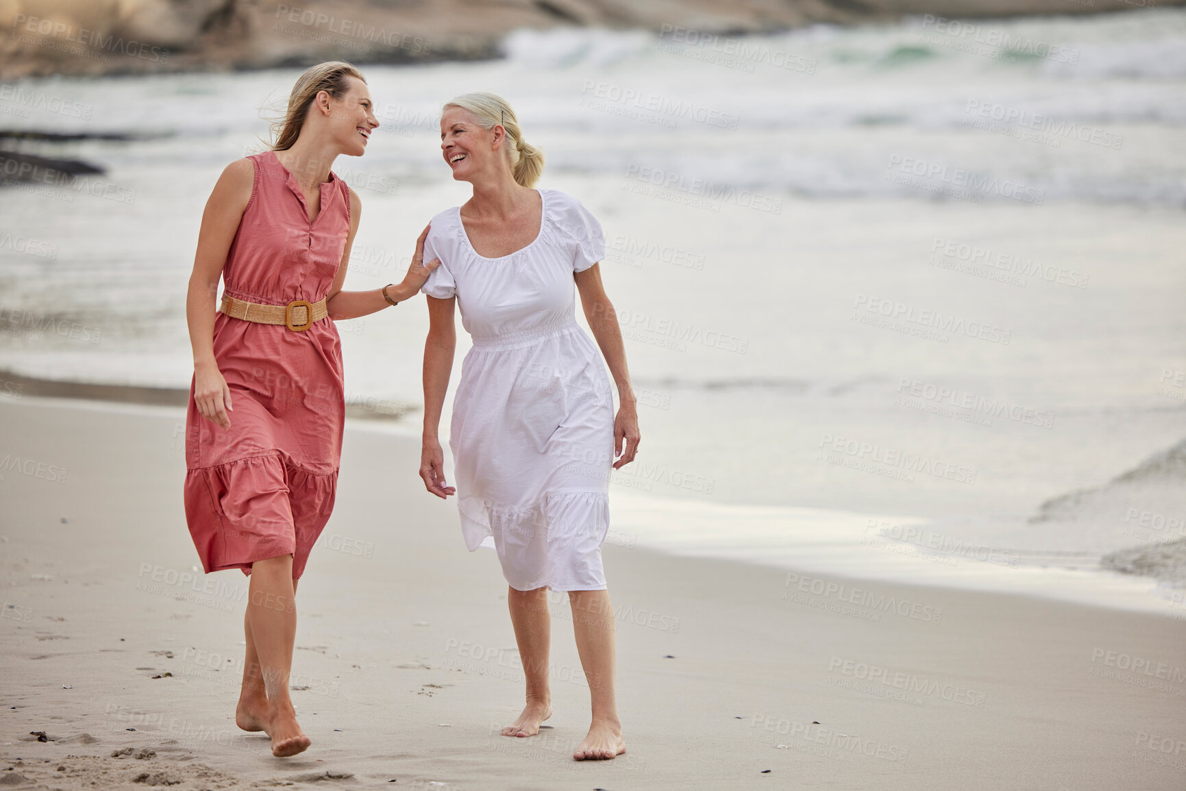 Buy stock photo Walk, beach and senior mom with daughter for bonding holiday, love and chat on weekend travel. Nature, mother and woman laughing on ocean adventure together with conversation, fun and island vacation