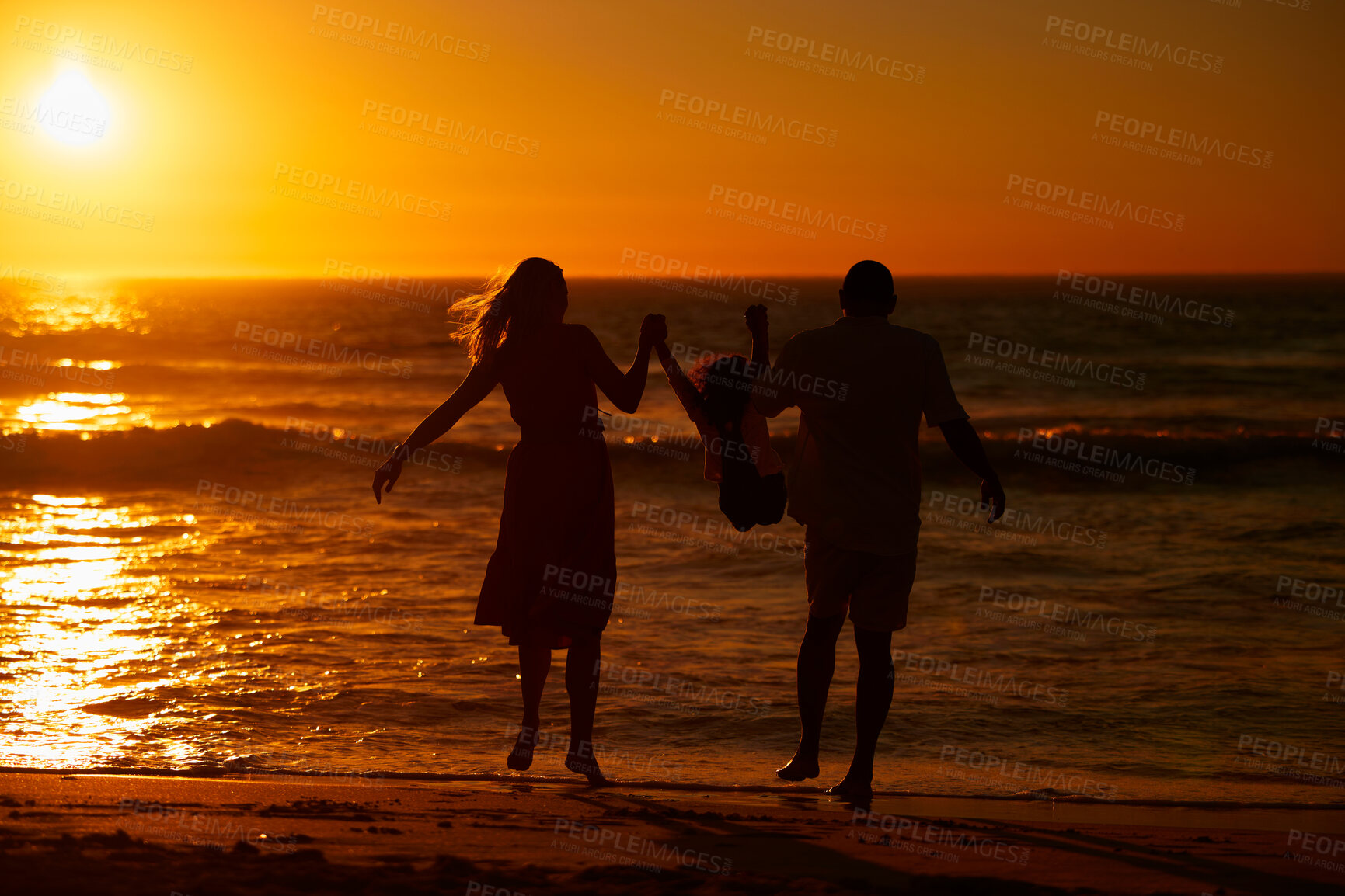 Buy stock photo Back, parents and kid with swing at beach for bonding on break, relax and fun in Spain. People, family and playful on silhouette at ocean on holiday with happiness for child development and growth