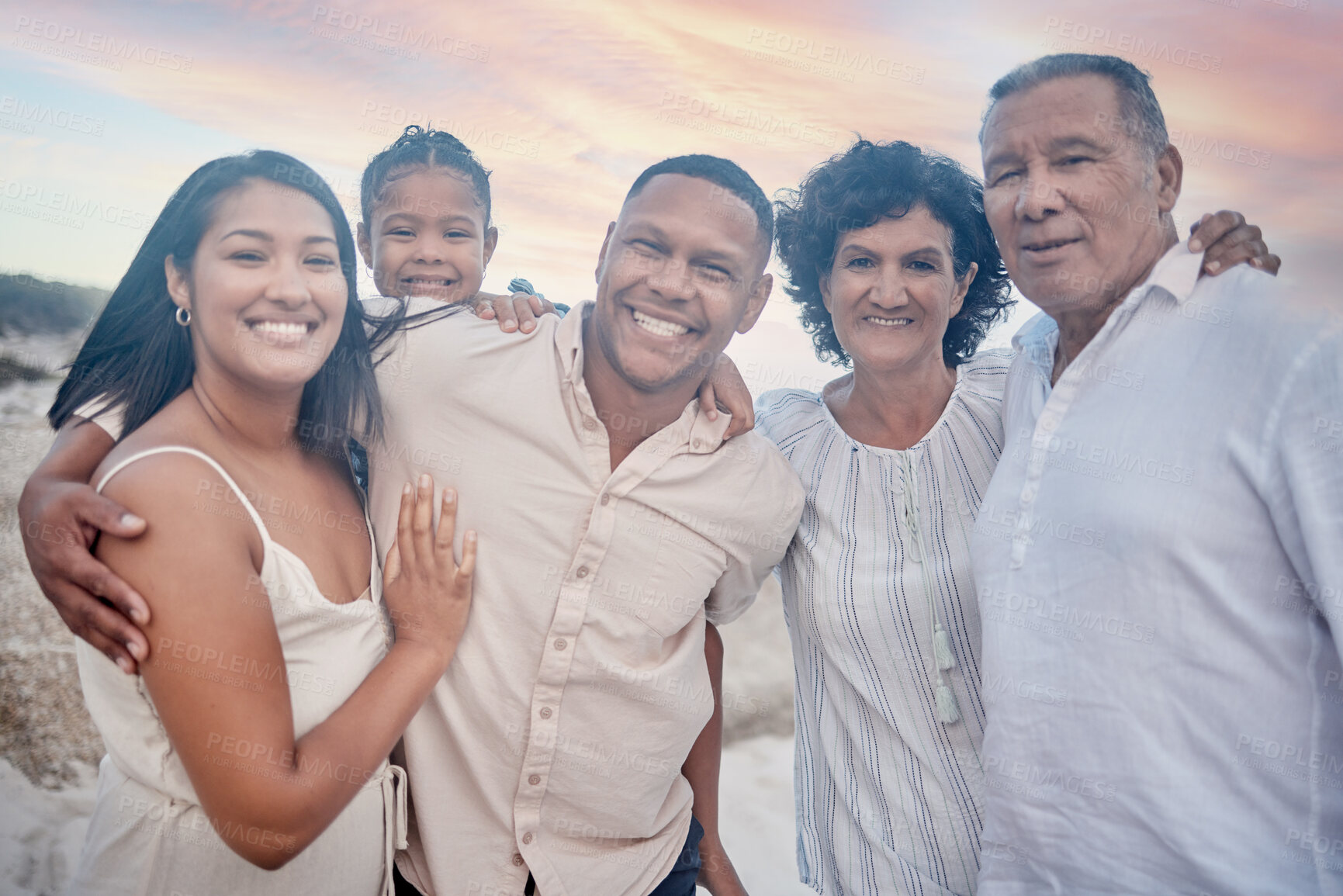 Buy stock photo Outdoor, portrait and big family with smile, beach and mature woman with old man, bonding and love. Happy, mom and kid with dad, sea and relax in holiday, vacation and travel with child in Portugal