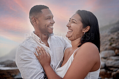 Buy stock photo Laugh, love and couple on beach at sunset on romantic date for travel with vacation or weekend trip. Happy, bonding and young man and woman with connection by ocean in evening on tropical holiday.