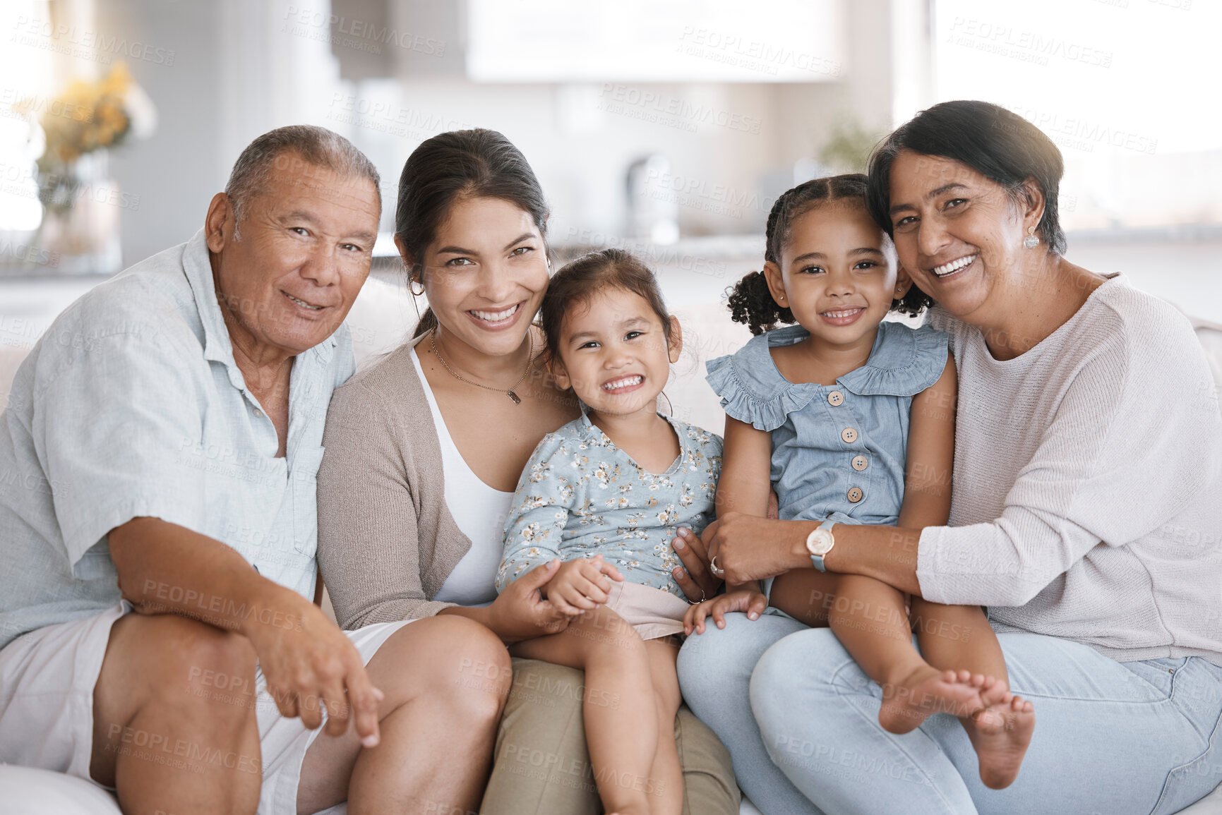 Buy stock photo Love, portrait and smile with family on sofa in living room of home together for bonding or visit. Happy, hug or relax with senior grandparents, mother and sibling children in apartment on weekend