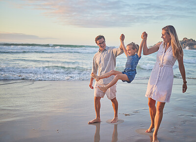 Buy stock photo Family, holding hands and swing with child at beach for outdoor fun, vacation and adventure together. Happy, mother and father with girl by ocean at sunset for love, support and holiday in Maldives