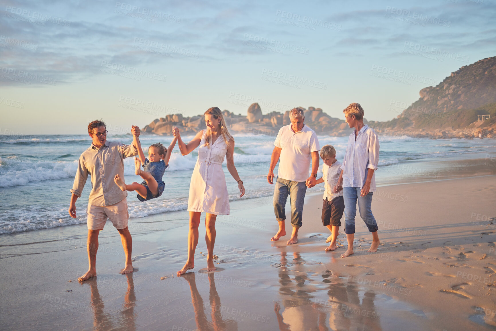 Buy stock photo Holding hands, ocean and big family with vacation, happiness and travel for adventure, fun and play. Generations, beach and grandparents with mother, father and kids with childhood, smile and journey