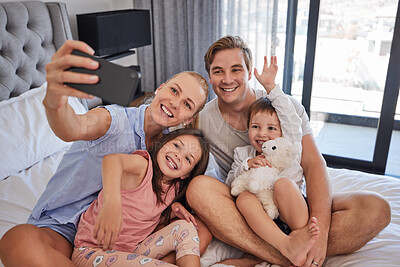 Buy stock photo Happy family, selfie and parents with kids in bedroom for photo, picture and memory. Video call, mom and dad with children for connection, love or people wave for greeting in home with stuffed animal