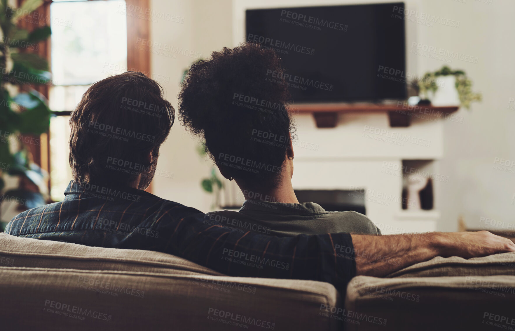 Buy stock photo Couple, home and television with hug, love and care together ready for a movie, tv show or web series. Back, living room and tech with streaming service or film subscription on a couch with people