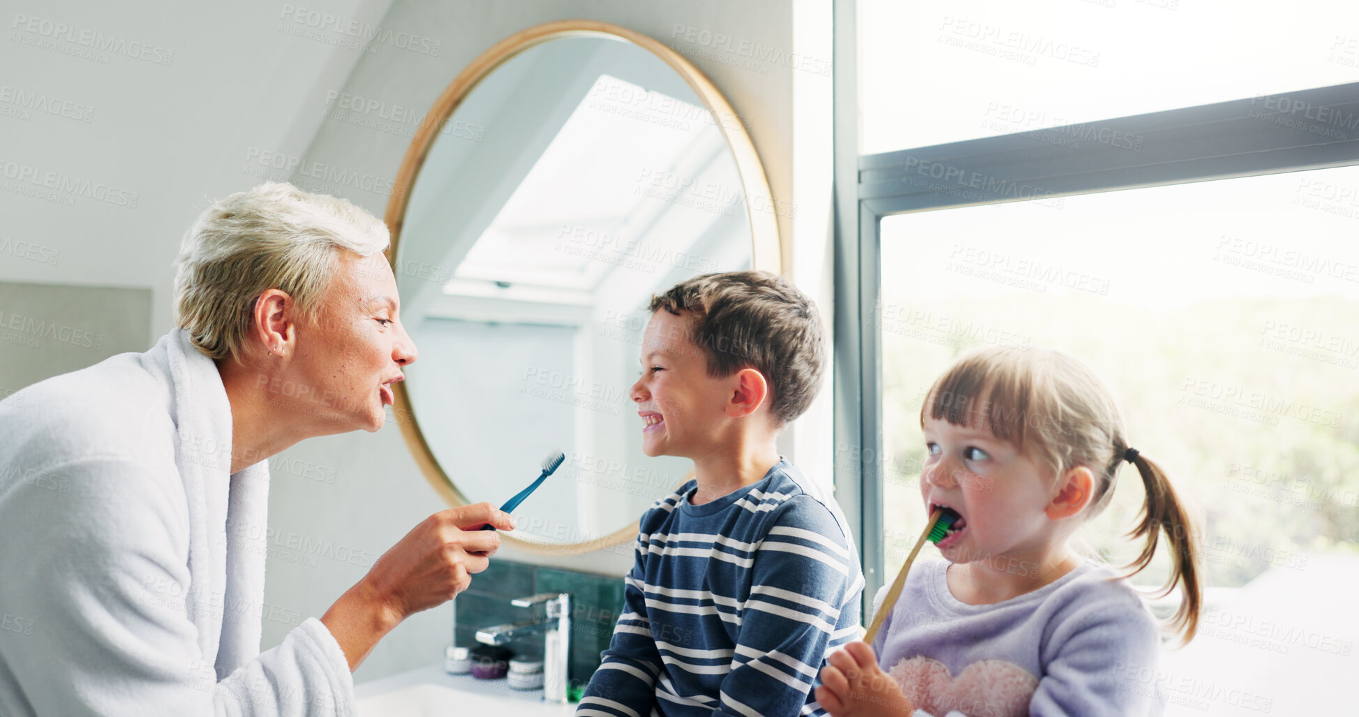 Buy stock photo Mother, children and play to brush teeth in bathroom for oral hygiene, dental health and cleaning mouth in morning. Woman, kids and toothbrush for teaching, breath care and family bonding at house