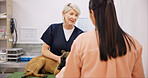 Mature, doctor and dog with owner in clinic checkup, hospital and veterinary healthcare and veterinarian. Animal care, pet and woman for diagnosis conversation, puppy wellness and professional help
