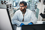 Laptop, medicine and science with man in laboratory for development, innovation or research. Computer, pharmaceuticals and study with serious scientist at work on medical breakthrough or discovery