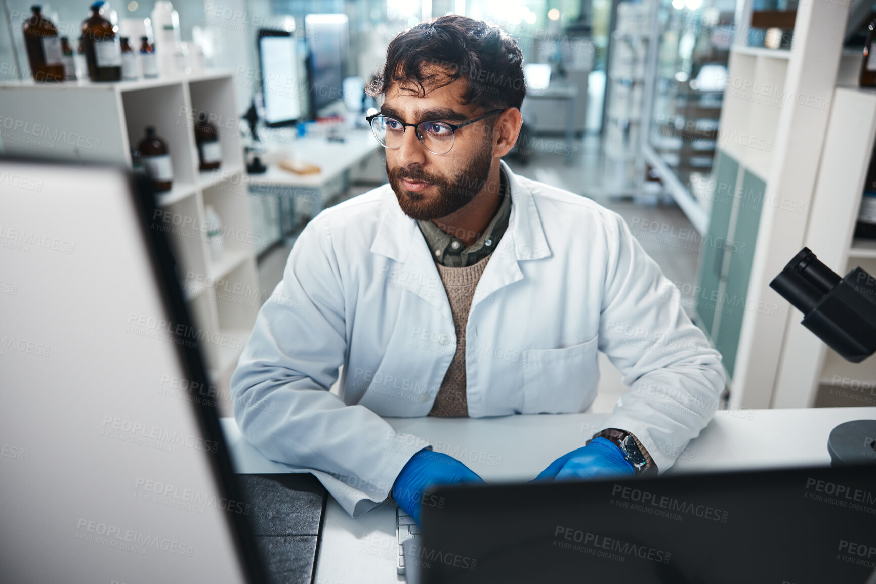 Buy stock photo Laptop, medicine and science with man in laboratory for development, innovation or research. Computer, pharmaceuticals and study with serious scientist at work on medical breakthrough or discovery