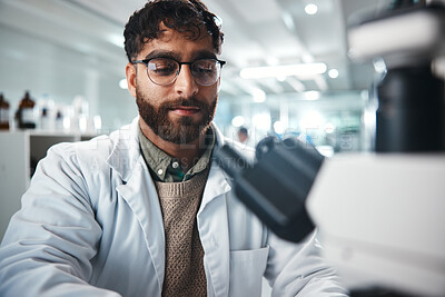 Buy stock photo Scientist, man and microscope for healthcare in lab of experiment research, medical data and studying bacteria. Person, researcher and biotechnology for pharmaceutical development of vaccine solution