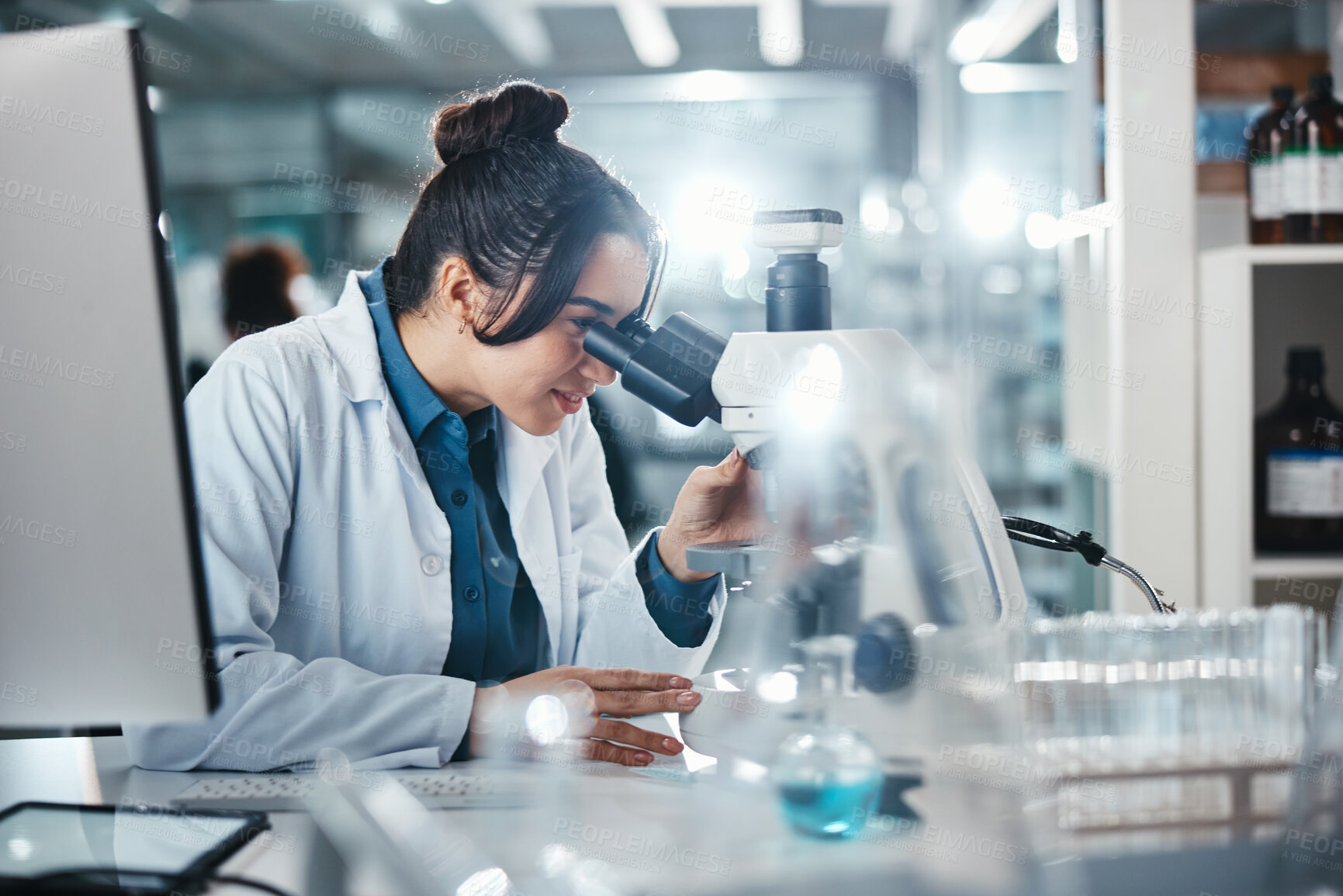 Buy stock photo Scientist, woman and microscope for healthcare in lab of experiment research, medical data or study bacteria. Smile, researcher and biotechnology for pharmaceutical development of vaccine production