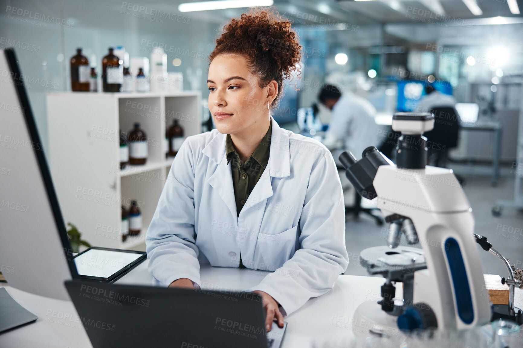 Buy stock photo Computer, DNA and science with woman in laboratory for development, innovation or research. Laptop, microscope and pharmaceuticals with scientist typing at work on medical breakthrough or discovery