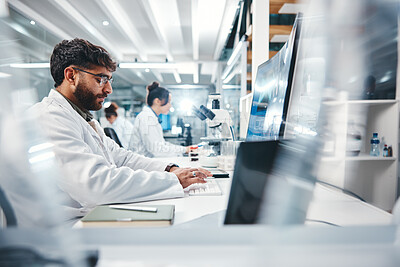 Buy stock photo Scientist, man and typing in laboratory on computer for medical results, investigation and pharmaceutical research. Male person, science and innovation for clinical study, review and development.