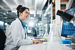 Laptop, woman and medical scientist in laboratory with online research for cancer clinical trial. Science, computer and female biologist with pharmaceutical discovery for healthcare innovation.