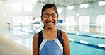 Girl, child and happy with portrait by pool for indoor swimming lessons, skill development and muscle growth. Female kid, water sports and student for learning, progress and improvement by school.