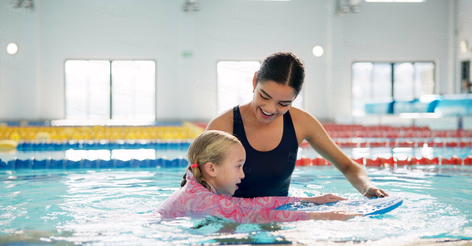 Buy stock photo Instructor, teaching and child in pool, swimming or woman with smile, proud or helping girl in water. Bathing suit, happy or learning with teacher in school for training of kid, sports or competition