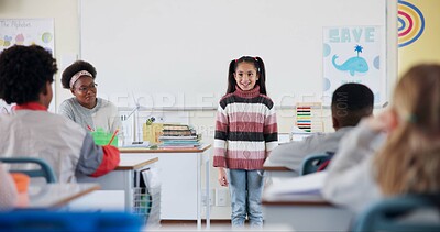 Buy stock photo Class, happy child and presentation for learning, education or knowledge in elementary school. Girl, project and speaking to students with teacher for renewable energy assignment and idea in lesson