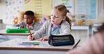 Girl, child and writing notes in classroom for learning, knowledge and info for assessment. Kid, notebook and education with scholarship, studying and attention at lesson for development at school