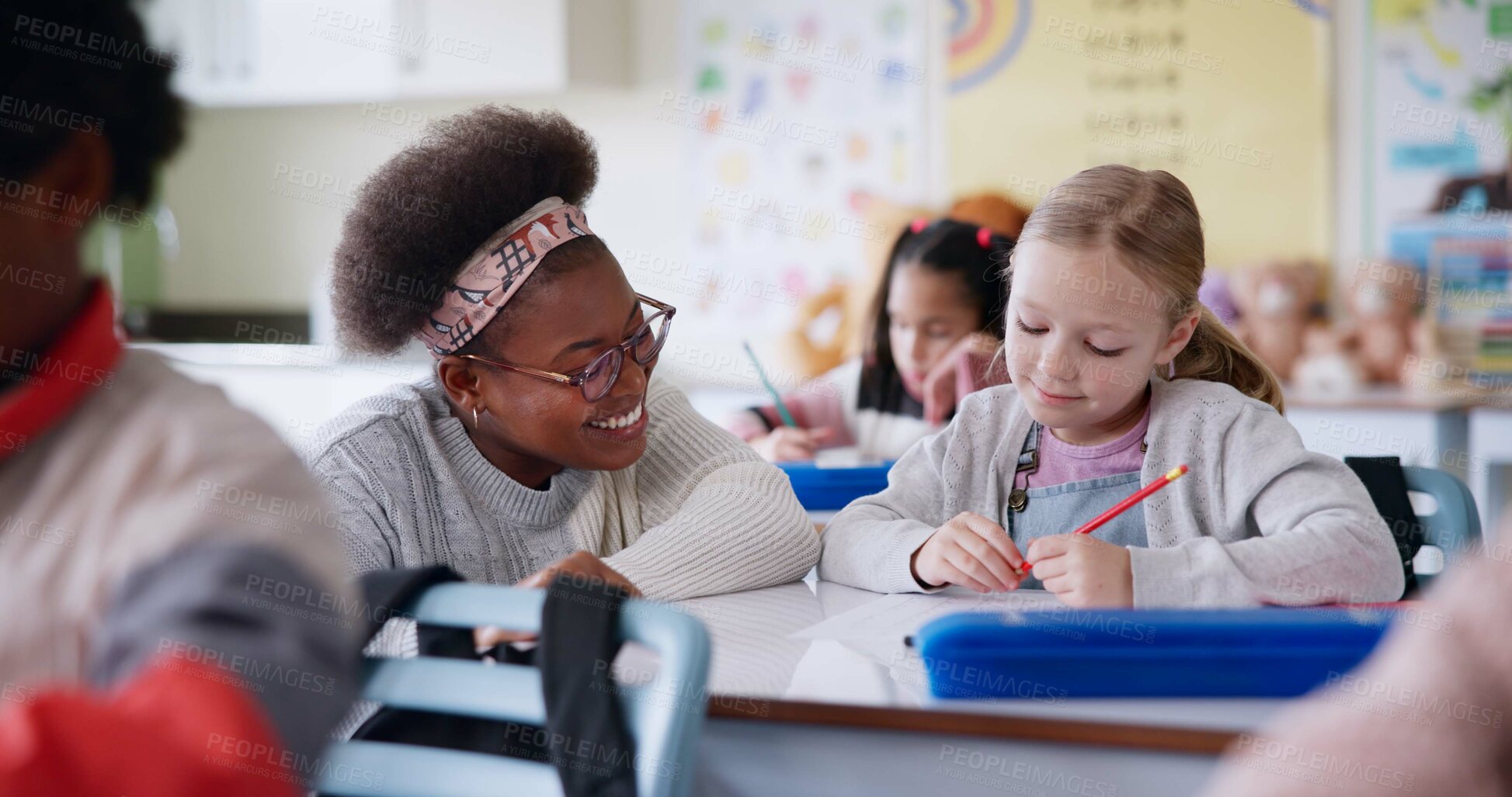 Buy stock photo Girl, teacher and talking in classroom with help, advice and smile for assessment for development. Woman, child and education with test, exam and check with care, happy and scholarship at school