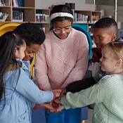 Students, library and hands together for unity in school with fun game ...