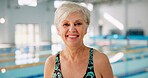 Senior woman, portrait and smile for swimming, wellness and mental health by indoor pool facility. Elderly person, face and happy in retirement with exercise for fitness, arthritis or aquatic therapy