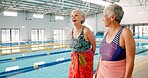 Fitness, senior people and friends in swimming class, laughing and happy for learning in health club. Joke, talking and walking in gym with chat, smile and pool with water for workout of old women