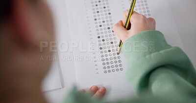 Buy stock photo Above, exam and person at desk for education, paper and multiple choice assessment at school. Student, lesson or writing on document for answer, quiz or questionnaire in class for learning evaluation