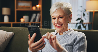 Buy stock photo Home, smile and mature woman with cellphone, reading and online for game, subscription and click on app. Living room, relax and playing with mobile in night, happy and winning on website and house