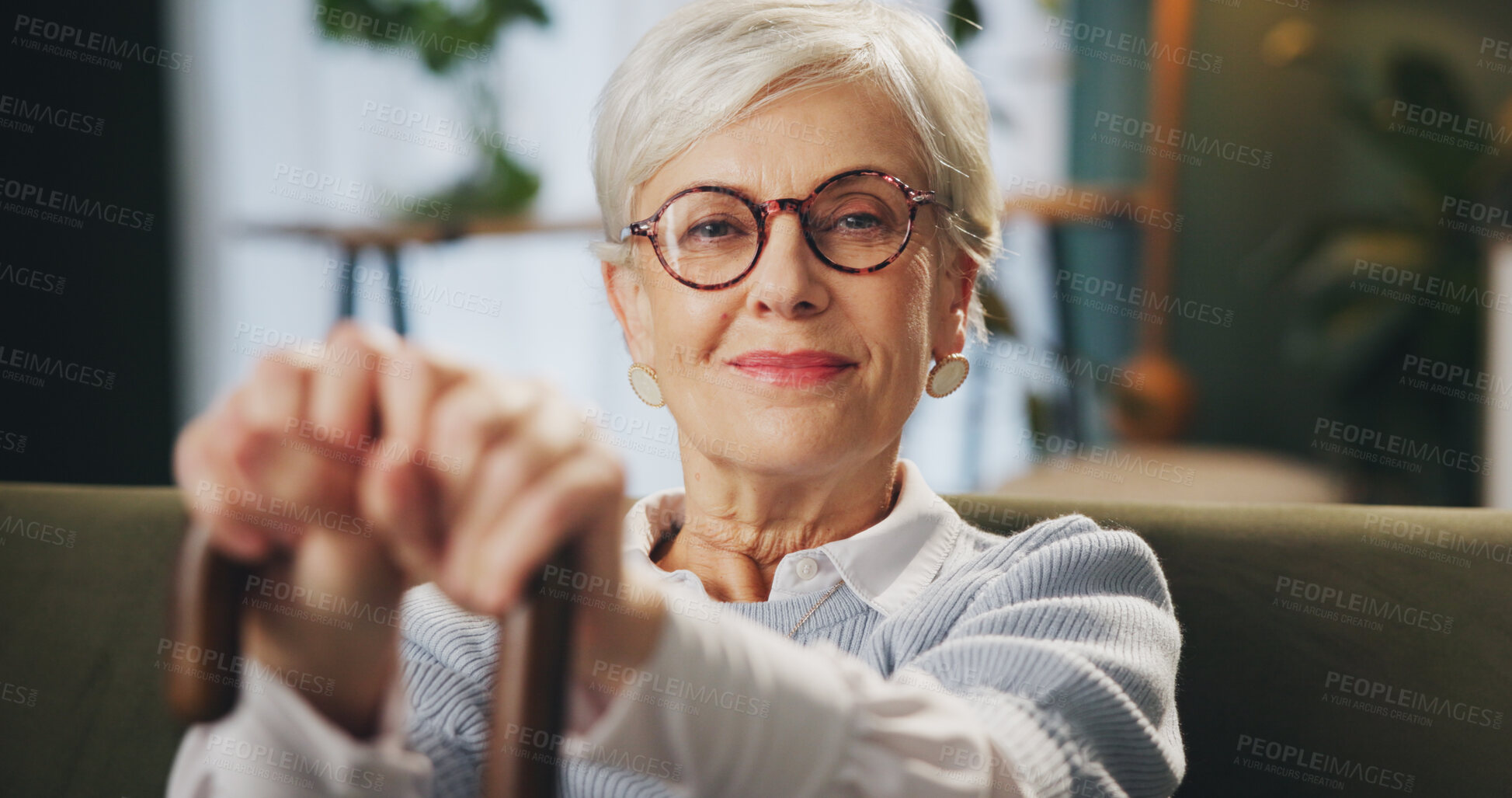 Buy stock photo Cane, portrait and senior woman with disability at home, arthritis and happiness in retirement. House, elderly lady and hands with walking stick for balance, vertigo disease and osteoporosis on sofa