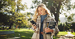 Student, woman and books in park with phone on walk with education, learning or thinking for development at campus. Person, reading and app on path, social media and scholarship at college in Germany