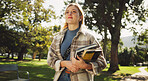 Student, woman and books in park for walk to class with education, learning or thinking for development at campus. Person, smile and vision on path, perspective and scholarship at college in Germany