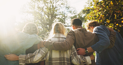 Buy stock photo Group, back and friends to relax outdoor on school break, lens flare and hug for bonding in summer. People, students and embrace with support, care and trust together for social reunion at park