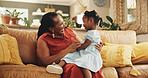 Happy, black woman and hug child at house for bonding, love and care together of family support of retirement. Smile, grandmother and girl relax on sofa with embrace, trust and connection in lounge