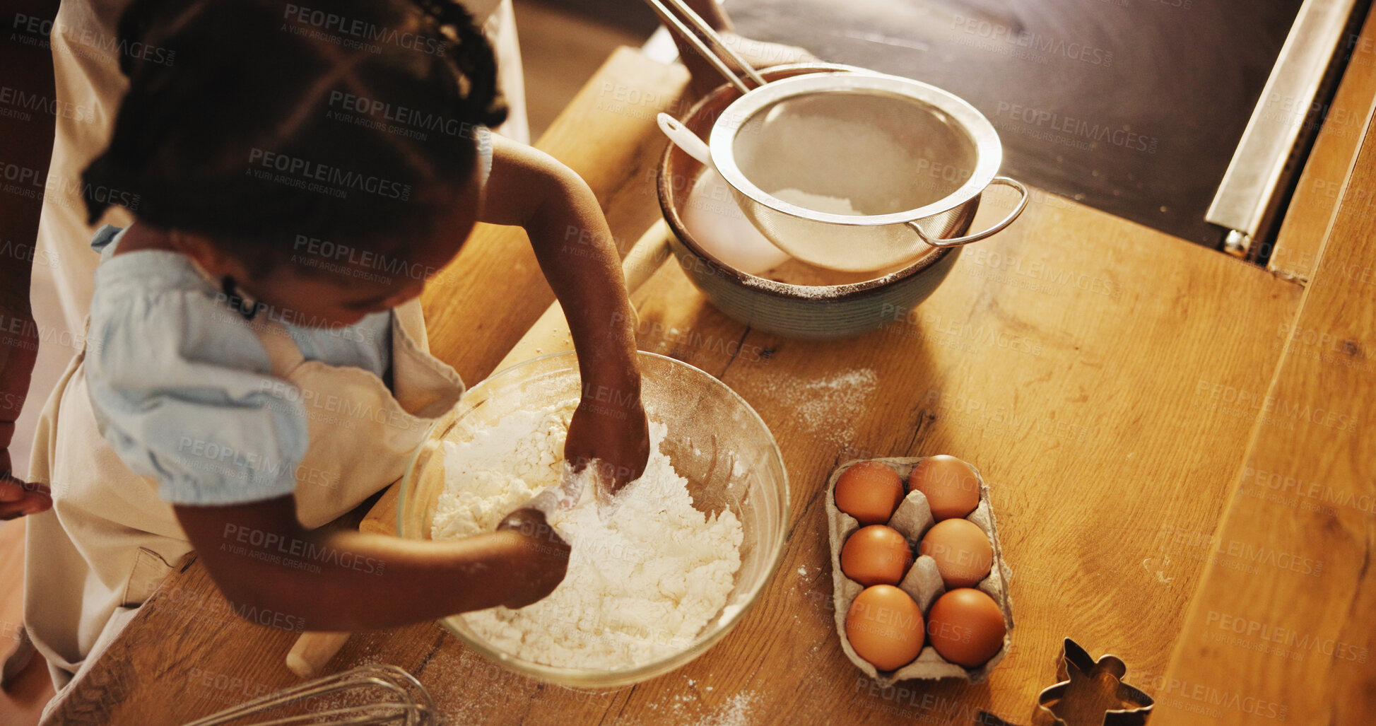 Buy stock photo Above, child and hands in flour for baking, recipe and cake ingredients at home. Little girl, development and fun activity in kitchen for growth, learning and making dough for cookies or biscuits